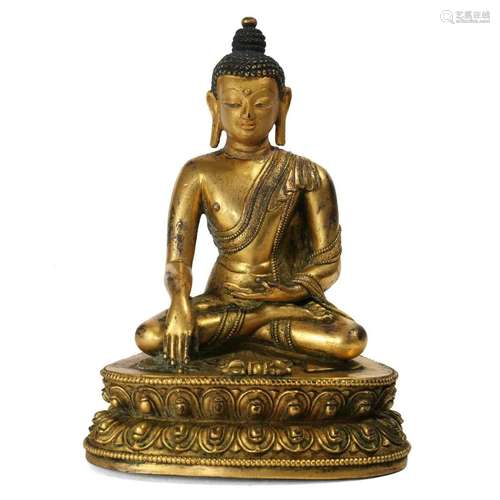 A GILT-BRONZE FIGURE OF SEATED SHAKYAMUNI