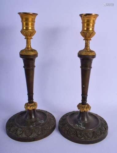 A PAIR OF 19TH CENTURY FRENCH TWO TONE BRONZE CANDLESTICKS m...