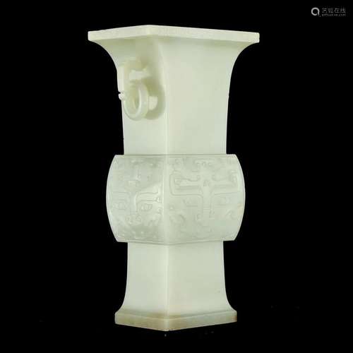 A WHITE JADE 'LONGEVITY' BEAKER VASE WITH HANDLES