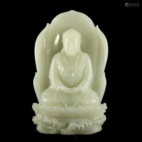 A WHITE JADE FIGURE OF SEATED SHAKYAMUNI