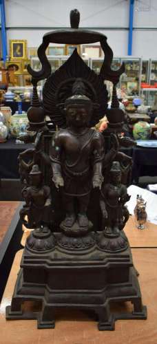 A LARGE ASIAN BRONZE FIGURE OF A BUDDHA modelled with attend...