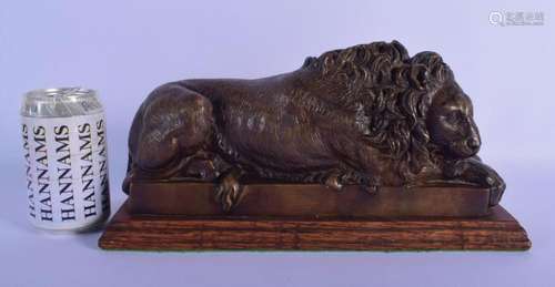 AN EARLY 20TH CENTURY EUROPEAN BRONZE FIGURE OF A SLEEPING L...