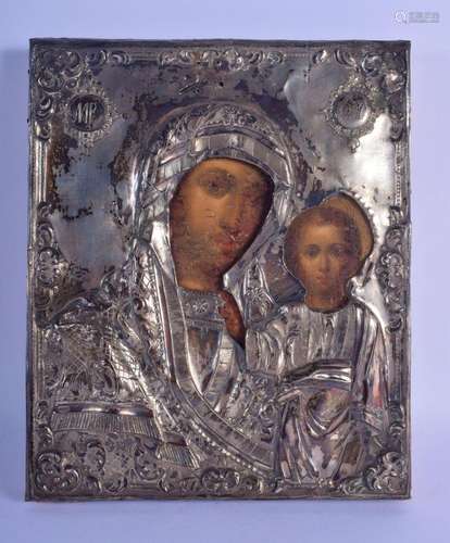 A 19TH CENTURY RUSSIAN SILVER MOUNTED PAINTED WOOD ICON deco...