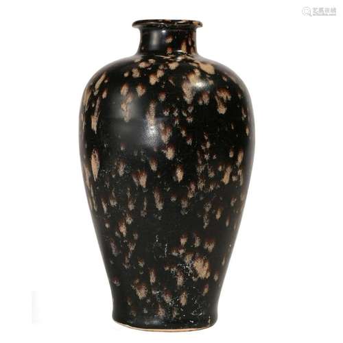 A BLACK-GLAZED VASE