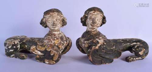 A RARE PAIR OF 18TH CENTURY EUROPEAN POLYCHROMED WOOD FIGURE...