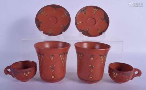 A PAIR OF TURKISH POTTERY TOPHANE CUPS AND SAUCERS together ...