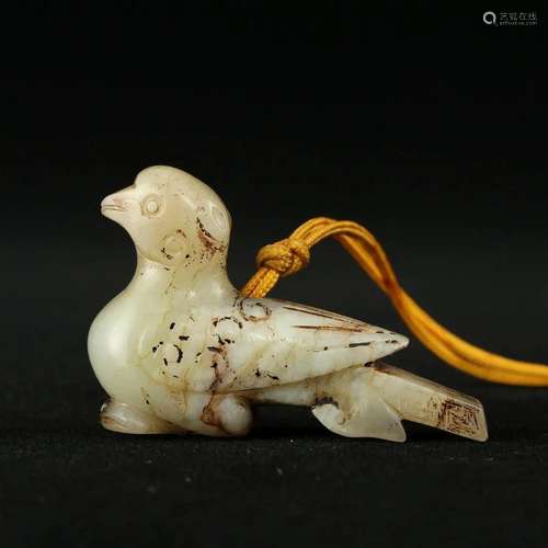 A WHITE JADE 'BIRD' PENDANT