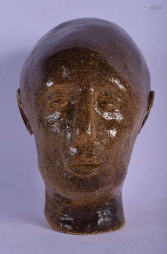 AN UNUSUAL CONTINENTAL STONEWARE SCULPTURE OF MALE possibly ...