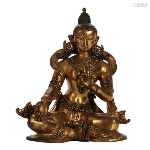 A GILT-BRONZE FIGURE OF SEATED GUANYIN