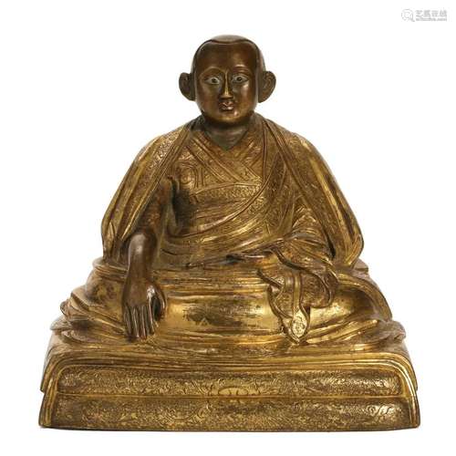 A GILT-BRONZE FIGURE OF SEATED LAMA