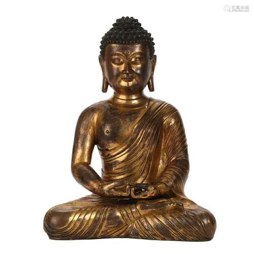 A GILT-BRONZE FIGURE OF SEATED SHAKYAMUNI