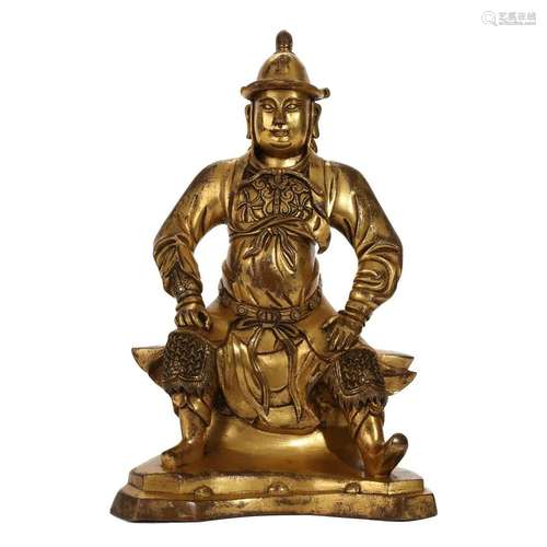 A GILT-BRONZE FIGURE OF A GUARDIAN