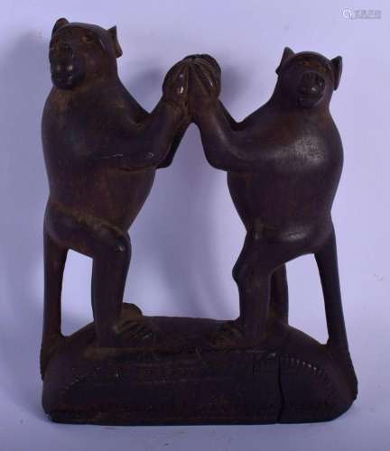 AN UNUSUAL TRIBAL CARVED WOOD FIGURE OF DANCING BABOONS mode...