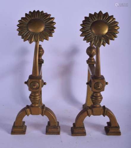 A PAIR OF ARTS AND CRAFTS BRASS FIRE SIDE DOGS modelled with...