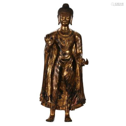 A GILT-BRONZE FIGURE OF STANDING SHAKYAMUNI