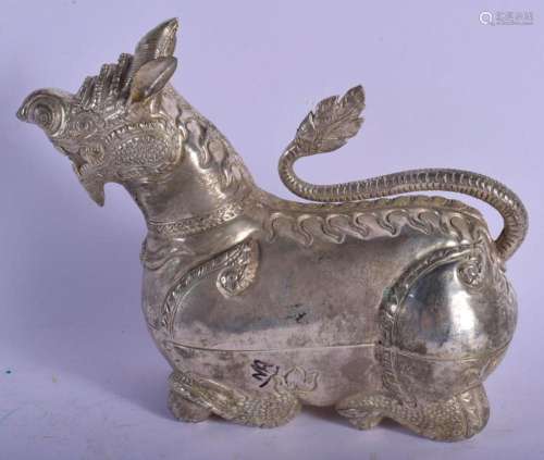 AN EARLY 20TH CENTURY SOUTH EAST ASIAN WHITE METAL BUDDHISTI...