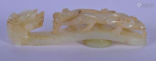 A 19TH CENTURY CHINESE CARVED GREENISH WHITE JADE BELT HOOK ...