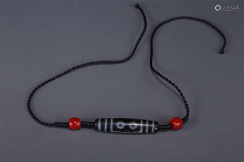 A Necklace of Five-Eye Dzi Bead.