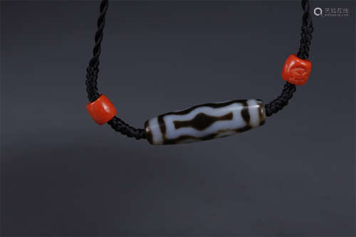 A Necklace of Four-Eye Dzi Bead.