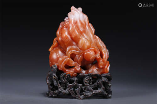 A Nanjiang Red Agate Buddha's Hand Sculpture.