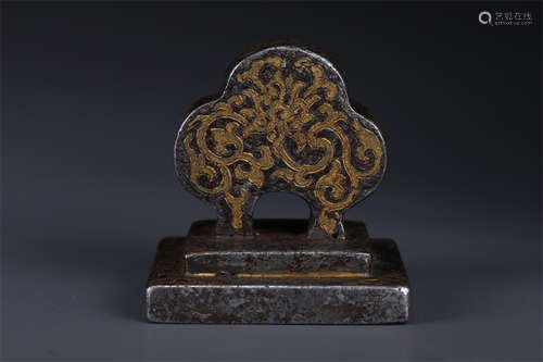 A Cast Iron Seal with Gold and Silver Inlay.