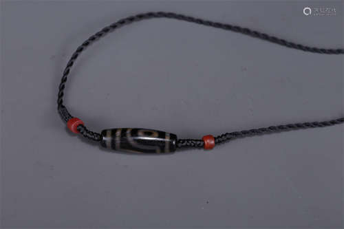 A Necklace of Two-Eye Dzi Bead.