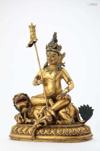 GILT BRONZE FIGURE OF JAMBHALA