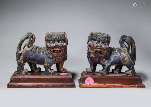 PAIR OF PAINTED WOOD FIGURES OF LION