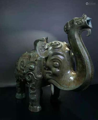 A BRONZE ELEPHANT SHAPED ORNAMENT