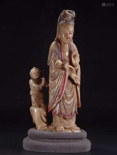 A CARVED SOAPSTONE GUANYIN STATUE