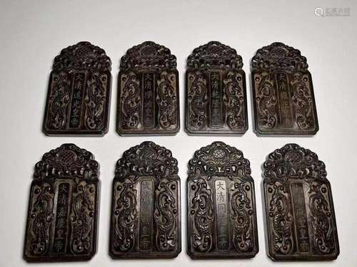 A SET OF EIGHT AGARWOOD TABLETS