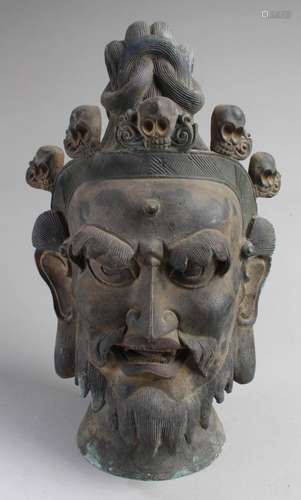 A CHINESE BRONZE DEITY HEAD STATUE