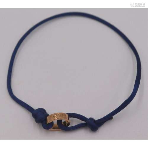 JEWELRY. Cartier Silk Cord 18kt Gold Love Bracelet
