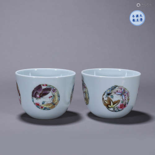 Pastel flowers and butterflies on the cup