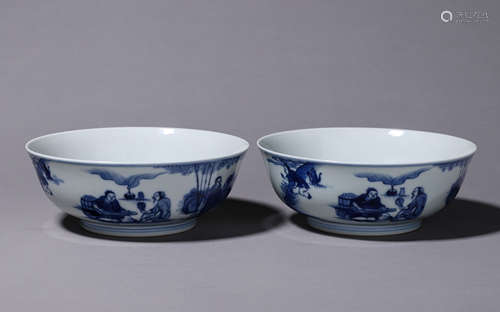 A pair of small bowls with blue and white character story