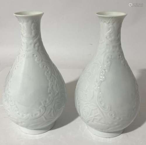 A Pair of Blanc de Chine Glazed Porcelain Blossom Vases, inc...