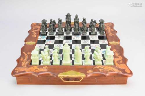 A Chinese carved wood and hardstone chess compendium