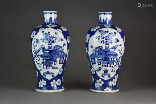 A pair of Chinese blue and white baluster vases, Kangxi mark...
