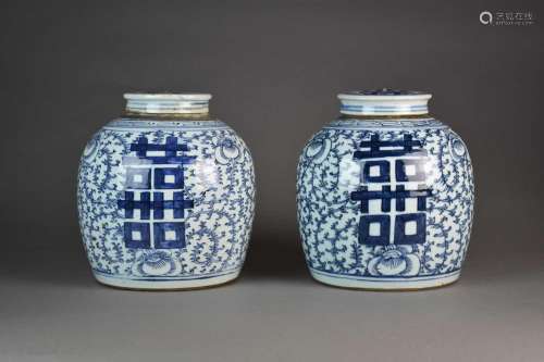 A pair of Chinese blue and white jars and covers, 19th centu...