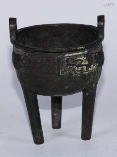 A Chinese bronze tripod censer, cast in the Archaic manner w...