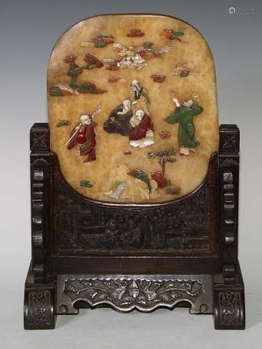A Chinese hardstone table screen, applied with figures and a...