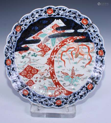 A Japanese Imari charger decorated with a fanciful bird, cra...