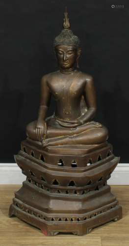 A large bronze Buddha Shakyamuni, pierced hexagonal stand, l...