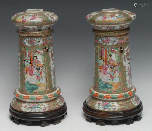 A pair of Chinese Cantonese side lights/ vases, decorated wi...