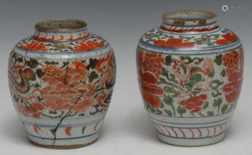 A pair of Chinese doucai ovoid jars, painted in tones of und...