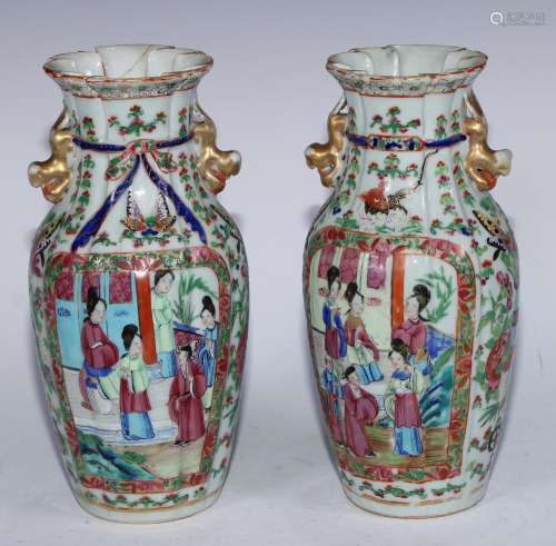 A pair of Chinese famille rose fluted ovoid vases, painted i...