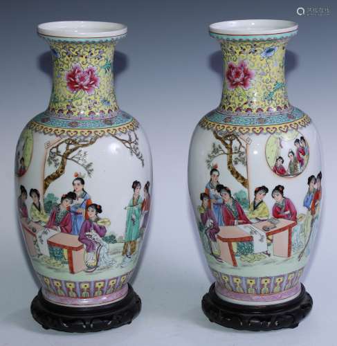A pair of Chinese ovoid vases, painted in polychrome with la...