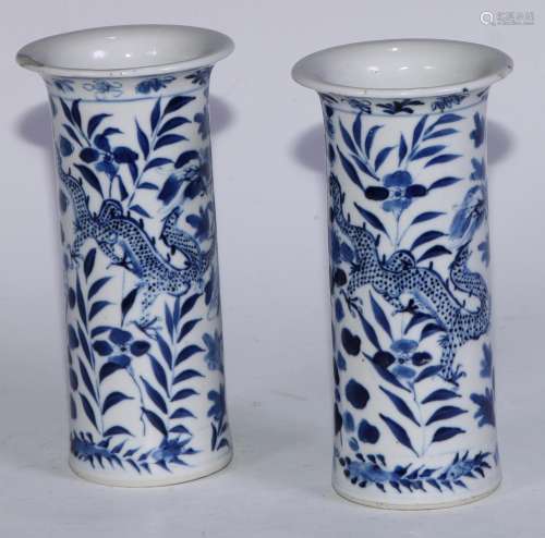 A pair of Chinese sleeve vases, painted in tones of undergla...