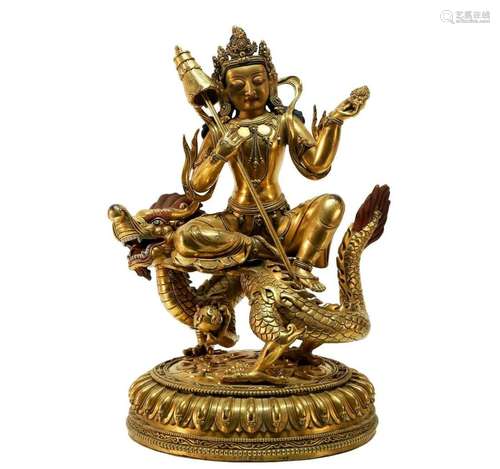 An exquisite gilt bronze Guanyin statue