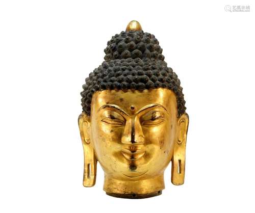 A beautiful gilt bronze Buddha head